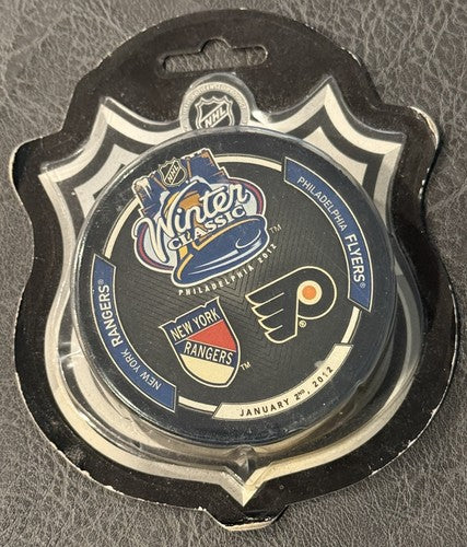 2012 WINTER CLASSIC NEW YORK RANGERS vs FLYERS Game Puck New Factory Sealed Mint