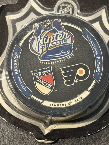 2012 WINTER CLASSIC NEW YORK RANGERS vs FLYERS Game Puck New Factory Sealed Mint