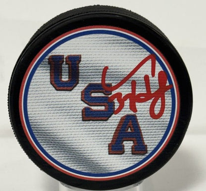 Connor Hellebuyck Signed Team USA 2026 Olympic Hockey Puck Gold Medal Fanatics