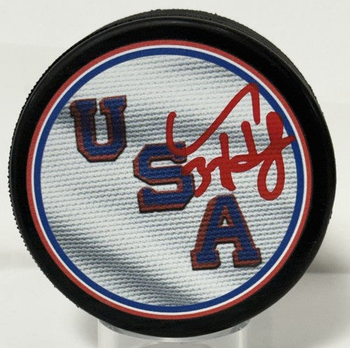 Connor Hellebuyck Signed Team USA 2026 Olympic Hockey Puck Gold Medal Fanatics